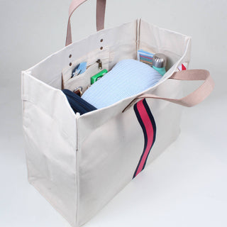 Interior view of ShoreBags Natural White tote bag with navy and red stripe down the middle and natural tan handles.