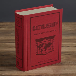 Battleship Vintage Bookshelf Edition by WS Game Company. This vintage bookshelf edition is truly a tribute to the original 1967 game, complete with the iconic red and blue cases, translucent ocean grids, ships, and pegs. 
This set includes: 
Fabric-wrapped book with integrated storage
2 Folding battle cases
10 Plastic ships
Red “hit” pegs
White “miss” pegs
Instructions