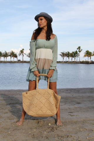 Maria XXL Tote Beach Bag by Zanatany  
Concepts. It's the perfect tote to fit all your beach accessories and more! Maria is a raffia bag handmade in Madagascar is the perfect daily accessory for a beach-goer. Its natural material and unique craftsmanship make it not only stylish, but also eco-friendly. 