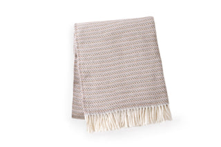 A Soft Idea Chestnut throw blanket with off white fringe.