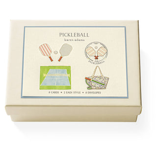 Pickleball Note Card Box by Karen Adams Designs.
This set of eight natural white note cards includes four different designs—each elegantly hand-embellished. 
Top-folded cards, blank on the inside. 