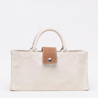 ShoreBags Natural Canvas wine tote with natural handles and Tan Leather Tab with snap.