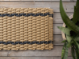 Wheat with charcoal stripes rope woven doormat.