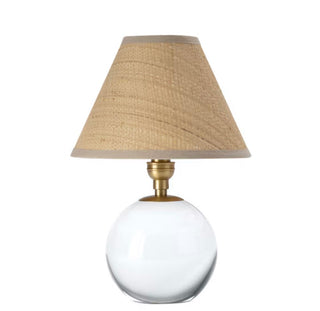 Giorgio crystal Mini Lamp by Regina Andrew. Crystal mini lamp with natural brass and a rattan shade. The Giorgio Mini Table Lamp delivers a warm, inviting light through its natural rattan shade, bringing texture and warmth to any space.