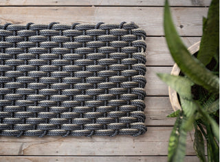 Charcoal rope woven doormat.