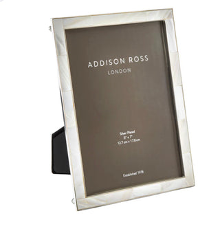 5x7 Shell and silver frame by Addison Ross. 
Mother of pearl picture frame with silver edge will complement any room.