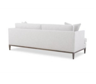 Wood frame sofa with cushions.