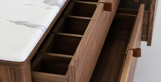 Detail of leather pulls, marble top and walnut dividers in top right drawer