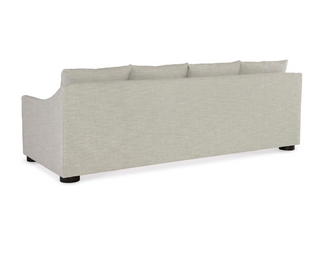 Lee Industries pale grey and off white sofa with a bench seat cushion and four back pillows. Back view with back cushions higher than the sofa frame.