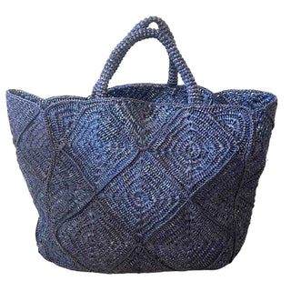 Nico Tote Bag by Zanatany Concepts. A raffia bag handmade in Madagascar is the perfect daily accessory for a beach-goer. Its natural material and unique craftsmanship make it not only stylish, but also eco-friendly. 