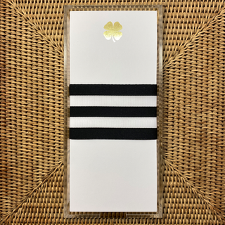 white pad with gold clover