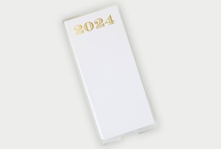 notepad with gold foil 2024 centered on top of pad