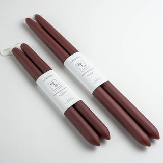 Two pairs of burgundy short and long tapers.