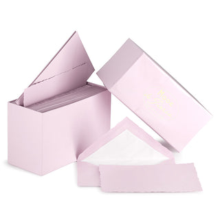 Blush colored box with tissue lined envelope and deckle edge paper